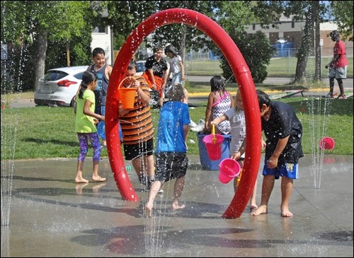 Tuesday afternoon, the Battlefords Boys and Girls Club celebrated its 40th birthday with a gathering at the clubhouse at 1301-104th St. in North Battleford. Children, youth, families and staff enjoyed games and play in the Senator Sparrow Splash Park and a hamburger supper. Photos by Jayne Foster