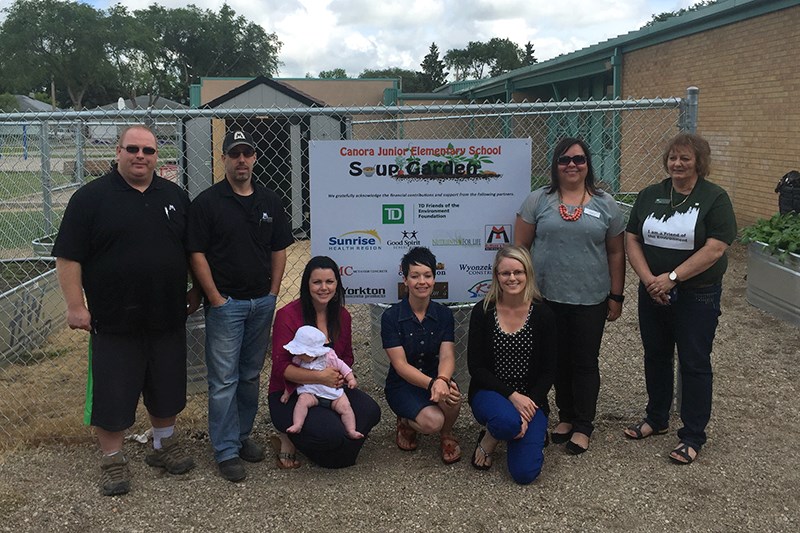 SCC members and sponsors of the Soup Garden posed in front of the new garden last week. From left, were: Ryan Zazuliak (McMunn & Yates), Jon Lawrence (McMunn & Yates), Jodie Kowalyshyn (McTavish Concrete), Naomi Paley (SCC), Jill Craig (SCC), Tracy Bielinski (Sunrise Health Region), and Ellen Zawislak (TD Bank).