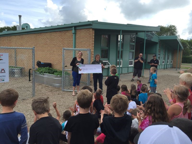 Jill Craig (left) accepted a cheque from TD Friends of the Environment, presented by Ellen Zawislak, a TD associate in Kamsack, for the opening of the Canora Junior Elementary School Soup Garden.