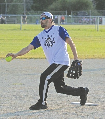Jason Stenbeck, pitching for the Party Piranhas slo pitch ball team, keeps his focus.