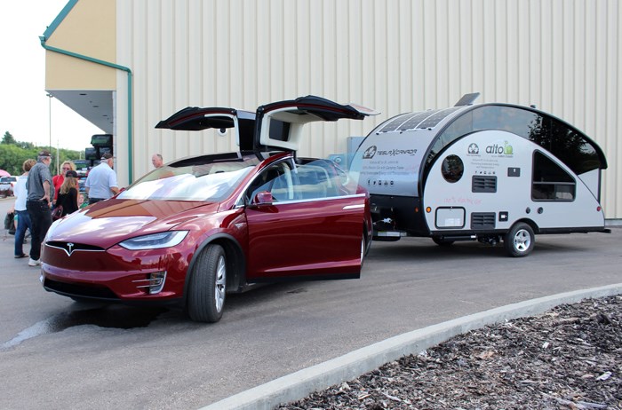 Rolf and Silke Sommerfeld visited Peavey Mart in Yorkton Saturday to charge their Tesla X and chat with local residents about their entirely electric cross-country tour promoting sustainable energy and transportation.