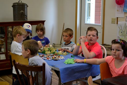 Although wet and windy weather curtailed some of the activities at the Rusty Relics Museum's Farm Day held Tuesday, July 12, kids from Cornerstone Family and Youth's Summer Camp (pictured) still found plenty of entertaining activities there.