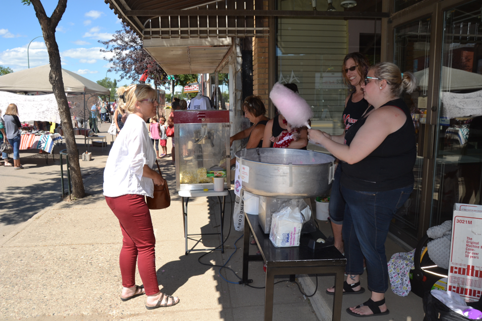Janelle Luddington and Jacinda Drew with the Estevan Kinettes made and served cotton candy to guests throughout the morning and afternoon.