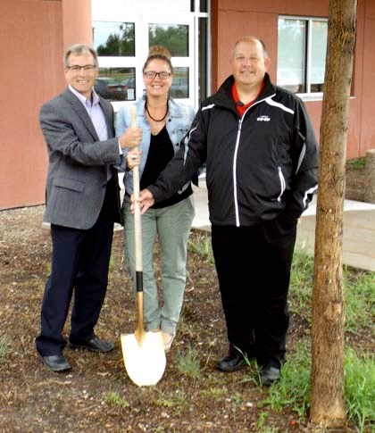 City Councillor Ross Fisher, YBID Chair Sophia Hamm and YBID Past Chair Bruce Thurston break ground on the project.