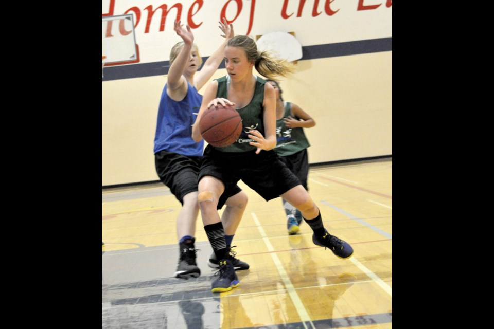 Team South East player Haylee Jones comes under pressure from Team Parkland Valley defender Tray-Lyn Fox. Photo by Jamie Harkins.