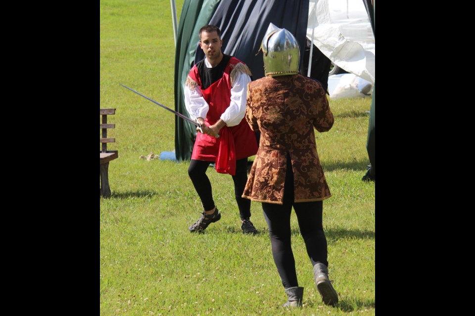 The second annual Renaissance Fair, hosted by the Paper Bag Players, brought the past to life. One of the highlights of the day was the theatre troupe’s production of The Sword and the Stone. Pictured, Kelly Schnurr, as King Arthur, engages in a bit of swordplay with his brother Kai, played by Justin Kacsmar.