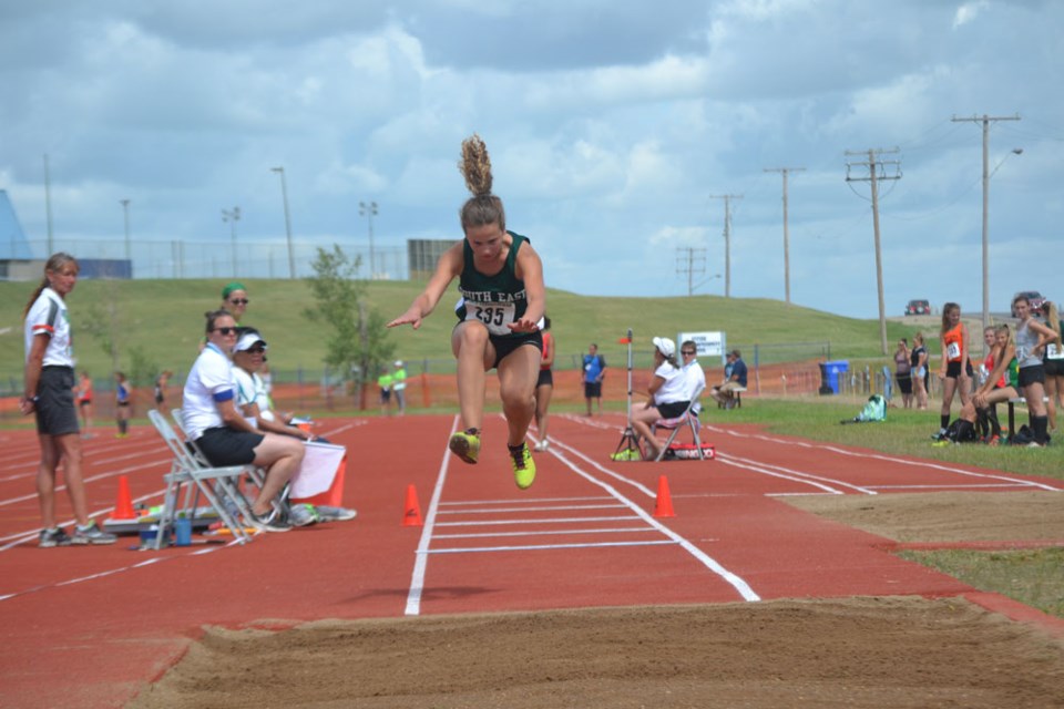 Megan Fichter, midair during the female trip jump event on July 27. Fichter ended up placing fourth, and was only within centimetres of medalling, with a jump distance of 11m.