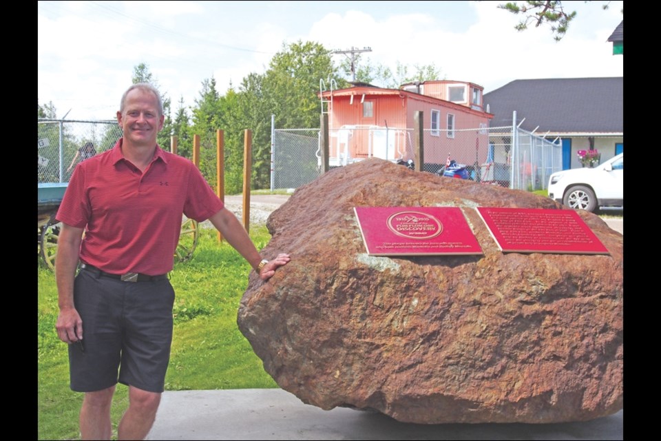 Richard Trudeau, director of operations for Hudbay, unveils a monument marking 100 years since the discovery of the Flin Flon ore body.