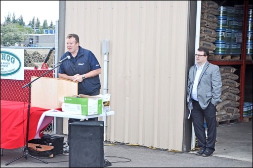 With Mike Nord looking on Councillor Ryan Bater extends greetings at the Discovery Co-op Cardlock grand re-opening Wednesday.