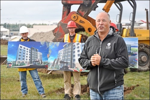 Billy Coles (right), president of CCR Hospitality/BCP Construction, speaks at the sod-turning for the new 105-room, six storey Comfort Inn and Suites hotel in North Battleford.