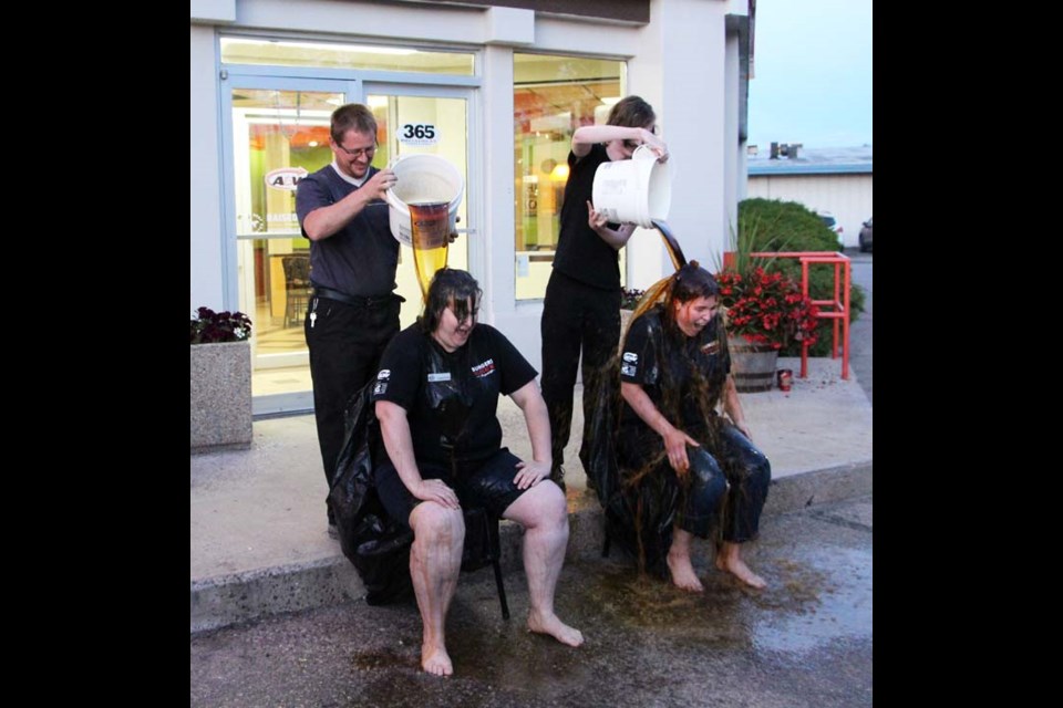 Yorkton’s A&W locations were part of a nation-wide effort by the restaurant chain to help end MS as part of the Burgers to Beat MS campaign. The West Broadway location brought in $3,831.51 and the east Broadway location bringing in $601.55, for a grand total of $4433.06. Money was raised through part of each teen burger sale, donations from guests as well as selling items from the renovations at West Broadway. To celebrate meeting their goal, the West Broadway location inaugurated the Root Beer Challenge, with assistant manager Samantha Hoffman (left) and supervisor Julie Lawson getting a bucket of root beer dumped on their heads by Robin Everett (left) and Chris MacCannell.
