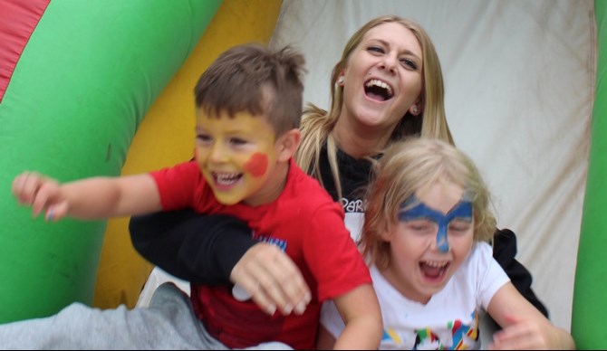 Cohen Brough, Taylor Davidson and Madeline Sapergia-Green took a tumble down a bouncy slide during the Hay Day family fun event at Joe Brain Children’s Petting Zoo last Friday, Aug. 26.