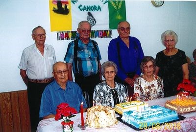 The people who celebrated birthdays in July, from left, were: (back row) John Fehr, Peter Wiebe, Mike Zeeben, and Olga Baulin, and (front) Nick Rudachyk, Merle Tratch, and Alice Lanstad.