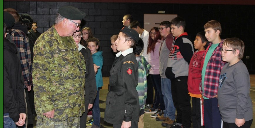 Capt. Bill McLean inspects army cadets lined up for their first parade of the year on Monday.