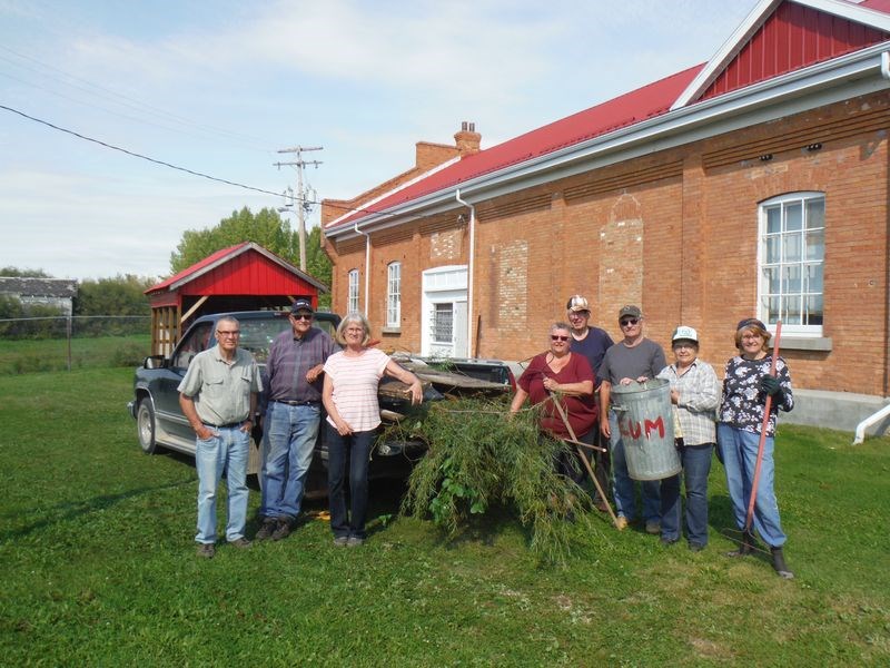 Among the volunteers who were at work cleaning up the grounds of the Power House Museum, getting the facility ready for Harvest Fest, which was the event which closed the museum for the season, from left, were: Len Benneke, Peter Cherkas, Darlene Brown, Betty Dix, Cliff Paluck, Marv McKay, Lydia Cherkas and Connie McKay.
