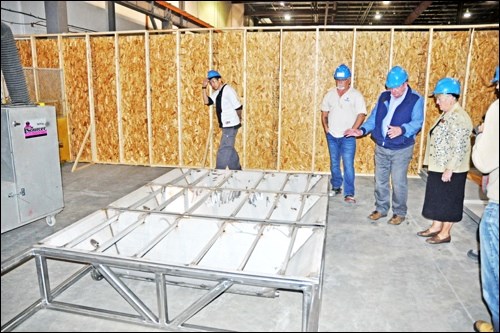 Mayor Sylvia Maljan and Town of Unity officials were in North Battleford at the Tecvalco Ltd. plant Tuesday to see the construction progress of the two Soneera Water Systems units being built there for the community. On the tour, they saw the progress on the base and the troughs for the units. Photos by John Cairns