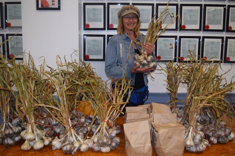 Carmen Linton of Kamsack sold bunches of fresh garlic at the third annual Garlic Festival and Trade Show held at the Kamsack Legion Hall on September 11.