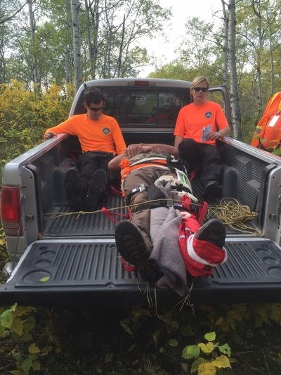 Stu Ritchie, centre, played the role of a hunter with a broken pelvis and leg while Mark Wells and Rebecca Basset assisted him.