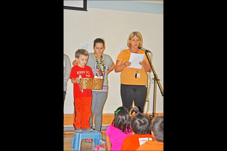 Students at St. Mary School honoured one of their own when they took part in the Terry Fox Run Friday afternoon. They honoured Dylan Delorme Dressyman, age five5, who is battling cancer. After paying tribute to Dylan inside the gymnasium they walked around the block in honour of Dylan and also in honour of residential school survivors. Photos by John Cairns