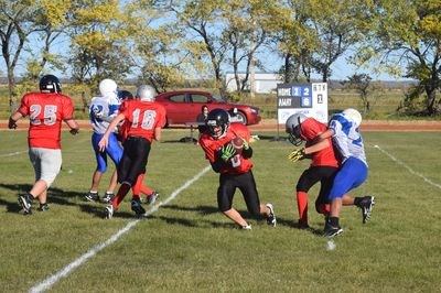 A lot of action happened all at once at the Canora junior Cougars’ game against the Kamsack Spartans. From left, Daniel Sanderson and Grady Wolkowski run after a Spartans’ member, Durban Hleboff carries the ball and Jacob Danyluk is tackled.