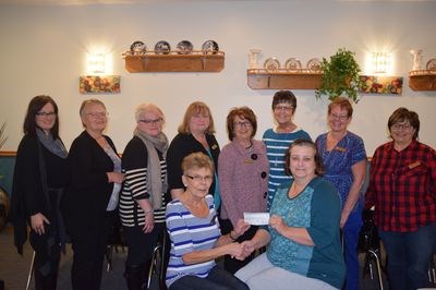 At the cheque presentation made October 11, from left, were: (back row) Shawna Leson, Sharon Ciesielski, Karen Wishlow, Val Morozoff, Gladys Tomski, Dodie Litowitz, Julie Westerman and Cynthia Gazdewich and (front) Bernice Wilgosh and Patti-Jo Donovan.