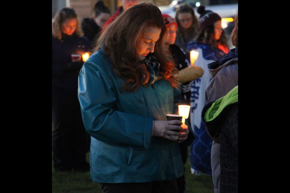 Paula Bali stands at the candlelight vigil for her daughter Mekayla, who has been missing since April. The Bali family has recently posted a $25,000 reward for her safe return.