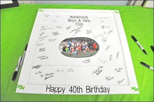 Guests of the Boys and Girls Club's 40th anniversary celebration were invited to sign the "guestbook," a commemorative board that will hang at the organization's main site. Photos by Shannon Kovalsky