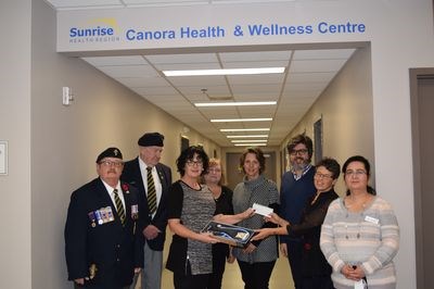 At the cheque presentation on October 18, from left, were: Chris Sokoloski, Ian White, Gina Rekochy (Legion president), Val Morozoff, Deb Gabora, Dr. Hamed Afshari, Lori Denis, and Dr. Seema Ahmed.