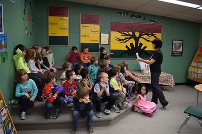Betty Tomilin, far right, read the Canora Junior Elementary School students a variety of books chosen as finalists for the Shining Willow awards, including If You Happen to Have a Dinosaur by Linda Bailey.