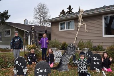 In front of his display for this year and cheering for the upcoming holiday, from left, were: Noah Prychak, Joshua Prychak, Falyn Ostafie, Luca Propp, Colby Fast and Natalie St. Mars.