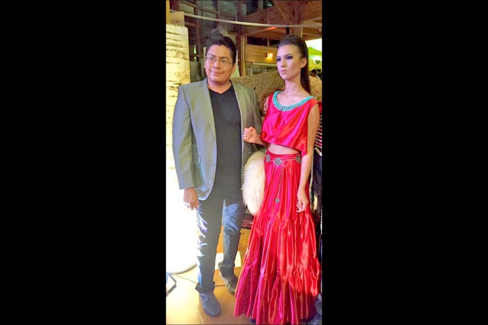 Amelia Boissoneau poses with Native American fashion designer Jolonzo Goldtooth.