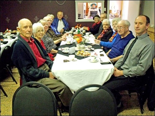 Honoured at the Radisson Discovery Co-op Founders’ Tea were: left - Harold and Merle Brunsch, Evelyn and Ed Schultz, Joyce and Wally Schultz; right - Rob Schmidt, Clayton and Louise Clark, Connie and Ed Ruzesky and Doris Lerch. Organizer Michelle Dubyk is in the kitchen. Photos by Lorraine Olinyk