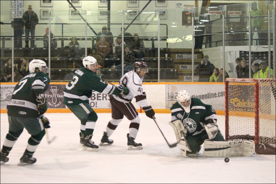 Klippers goaltender Justen Close makes a save on Bombers sniper Dondre Watson as Andrew McCaan and Clive Rozdeba trail the play on Saturday, Oct. 22 at the Whitney Forum.