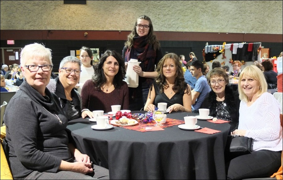 Among those attending the Bazaar were (from left) Maxine Long, Cathy Wotton, Coreen Hatherly, server Andie Shaw, Ronna Whitbread, Millicent Quesnel and Cheryl Anderson.