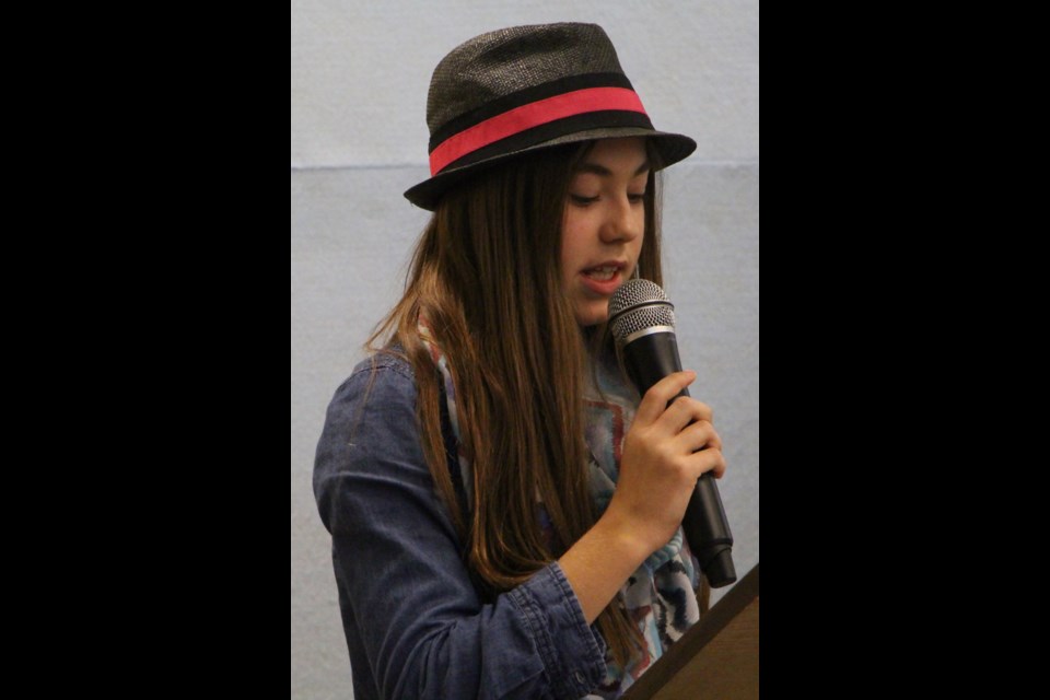Story tellers young and old participated in the first annual Story Slam competition. The readers include, Kaitlyn Kelly and Arliss Dellow.