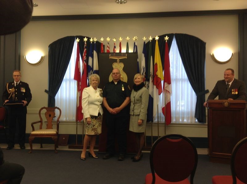 Lieutenant Governor Vaughn Solomon Schofield, left, and Nadine Wilson, provincial secretary, congratulated Barry Golay of Kamsack last week when he was presented with the Saskatchewan Protective Services Medal.