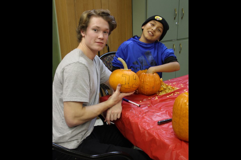 Time to carve Halloween is a time to celebrate for Big Brothers Big Sisters of Yorkton and area, and the holiday was an opportunity for bigs and littles, as well as the Yorkton Terriers, to get together for fun, games and a bit of pumpkin carving. Kaleb Bell and Justin Hotomani, pictured (l-r), had their pumpkins all planned out. The pumpkins were on display at the Co-op Pumpkin Walk.