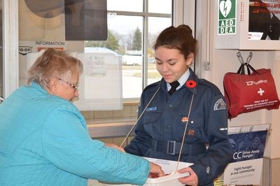 Gracie Paul accepted a donation from a customer shopping at the Gateway Co-op on October 29 as part of the Royal Canadian Legion’s poppy campaign, which is supported by the Canora Air Cadets.