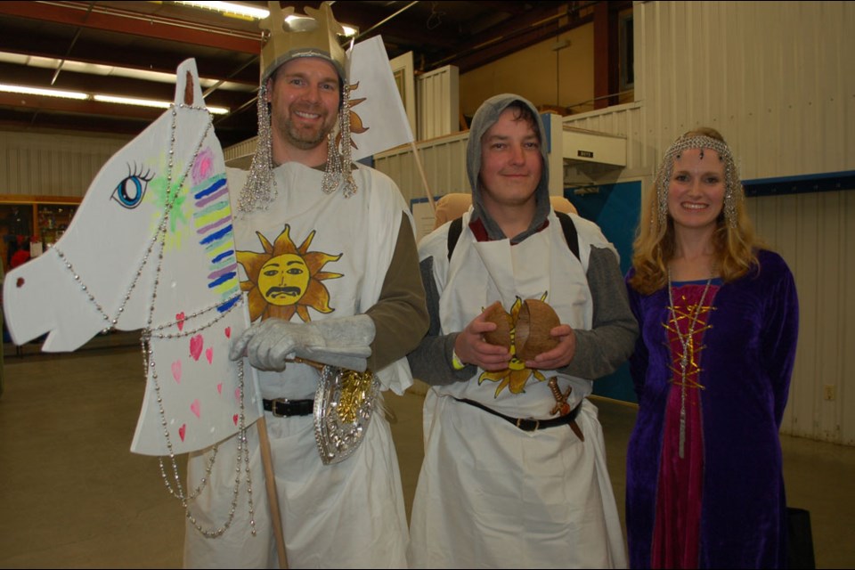 Getting into the spirit of the first-ever Estevan Derby for hobby horses, this trio of Aaron Salamon (left) Mike Holowchuk and Nanette Salamon dressed for the occasion by depicting characters in the well known Monty Phython movie that saw Python characters riding off to seek the Holy Grail, on a make believe horse, like the ones used in the Estevan Derby that attracted 45 entries on Saturday night. Alas, this entry did not find their Grail either.
