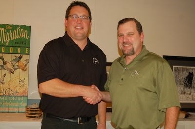 Conrad Peterson, chairperson of the East Central Flyway committee, greeted Travis Behning, fundraising manager for Ducks Unlimited.