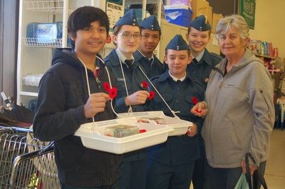 Betty Tonn stopped by and purchased a poppy for the cadets on November 5. From left, were: Dean Terrial, Rayanne Westermann, Christian Acosta, Harry Bartel, Jordan Lowe and Tonn.