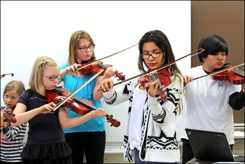 Students in the Battlefords Community Youth Strings Program played their violins at  Ecole Monseigneur Blaise Morand last Thursday. Photos by Lucas Punkari