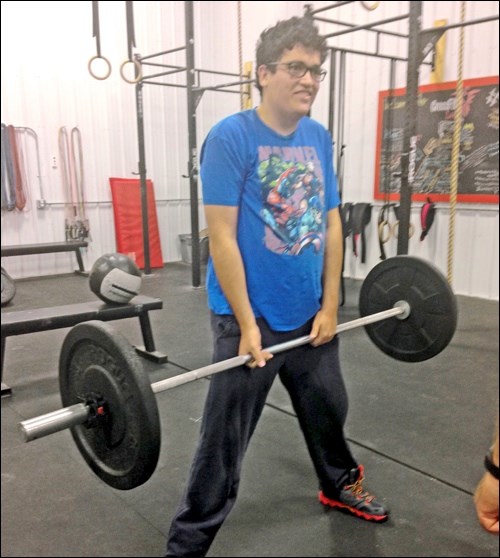 Ben performs a sumo deadlift.