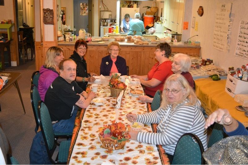The Norquay Emmanuel Lutheran Church held a two-day tea, bake and rummage sale on October 27 and 28. Among the persons who met for tea, from left, clockwise, were: Faron and Charlene Brown of Calgary; Cindy Wheeler of Spirit River, Alta.; Helen Heskin, Margaret Killniak and Ida Johnson, all of Norquay, and Sandra Kateryniuk of Hyas. In the kitchen were Donna Lulashnyk and Loraine Knutson.
