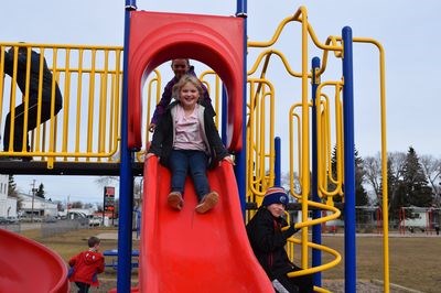 Trying out the new equipment at Canora Junior Elementary School were Brenna Reine, Cambrie Ostafie (behind) and Cayden Kelly.