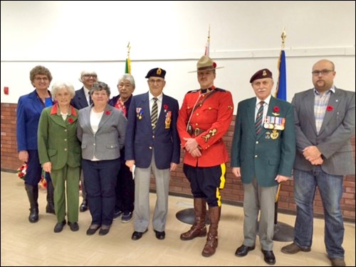 Participating in the Remembrance Day service at Mayfair Hall were: front row - Lorena Lafreniere, Jan Cherwinski, Rollie Pelletier, Cst. Donovan Kajner, Ghislain Bellavance, Curtis Babiy; back row - Ruby Rafuse, Jean Pelletier and Sally Salisburg.