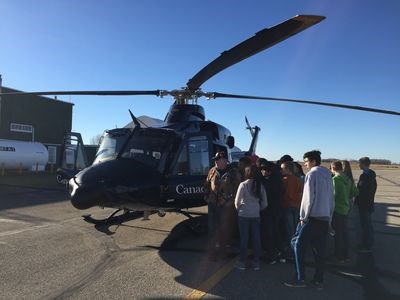 A Canadian Armed Forces helicopter landed at the airport for a short time and allowed the cadets to tour the helicopter.