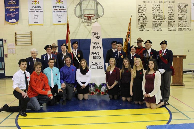 The Remembrance Day program held at the Norquay School on November 10 included members of the Kamsack RCMP, members of the Norquay branch of the Royal Canadian Legion, and (front, from left) students: Jesse Andrusiak, Tyson Lasko, Cody Heskin, Calum Livingstone, Anna Howard, Elena Gustafson, Keely Foster, Brooklyn Olson and Emily Livingstone.