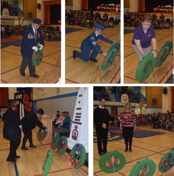 Placing wreaths at the memorial during the Remembrance Day service held at the KCI on November 10, from left, were: (top row) Jim Woodward on behalf of the Kamsack Legion; Keanna Romaniuk on behalf of the Kamsack air cadets; Mayor Nancy Brunt on behalf of the Town of Kamsack, and (bottom row) Kendra Simon (vice-principal) and Karie Thomas (principal) on behalf of the Victoria School, and Ryan Gareau (vice-principal) and Tracy Forsythe (principal) on behalf of the KCI.