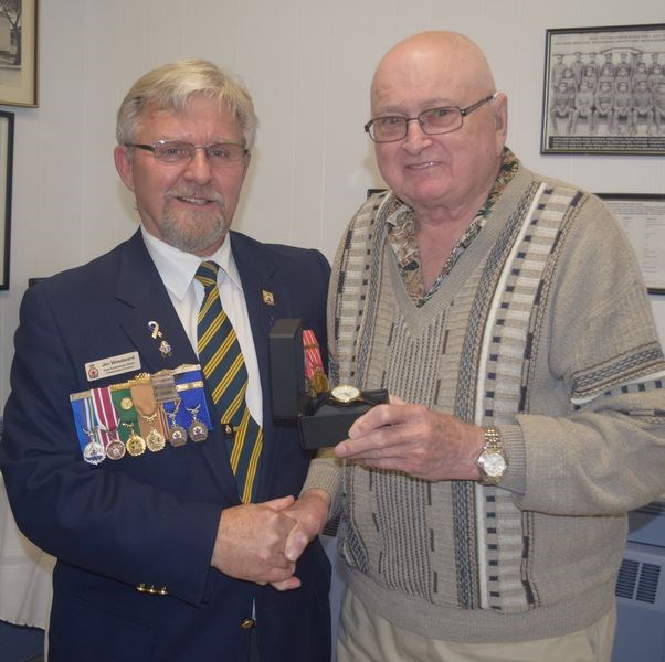 John Welykholowa, right, was named the Kamsack branch of the Royal Canadian Legion volunteer of the year during the Remembrance Day banquet on Friday.